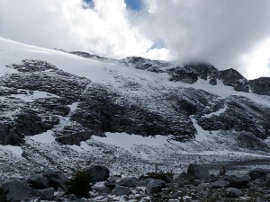 Snow covered cliffs. The glacier has retreated above,  leaving these polished and smooth