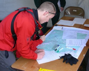 SAR Member using a map